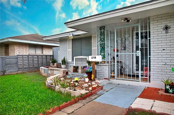 a view of a patio with table and chairs and potted plants