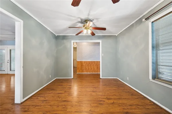 a kitchen with stainless steel appliances kitchen island granite countertop a stove a sink and a refrigerator