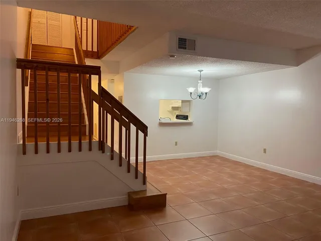 a view of a hallway with staircase