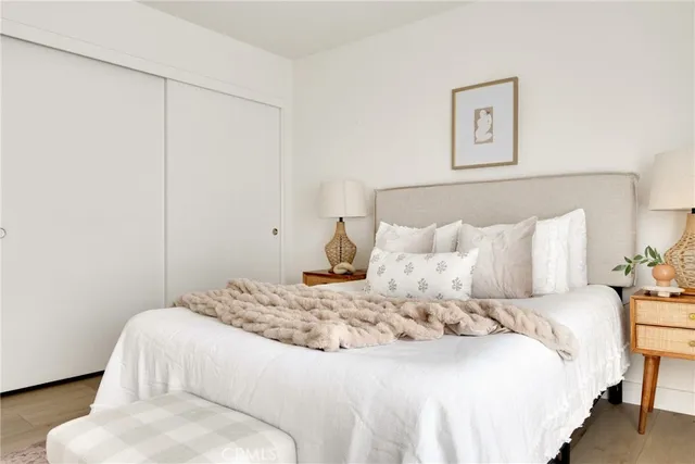 a bedroom with a bed and a couch