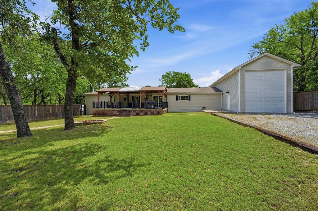 212 Sunset Road Pottsboro, TX 75076 - Photo 28 of 40 a view of a house with a back yard