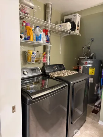 a kitchen with stainless steel appliances granite countertop a sink and a stove
