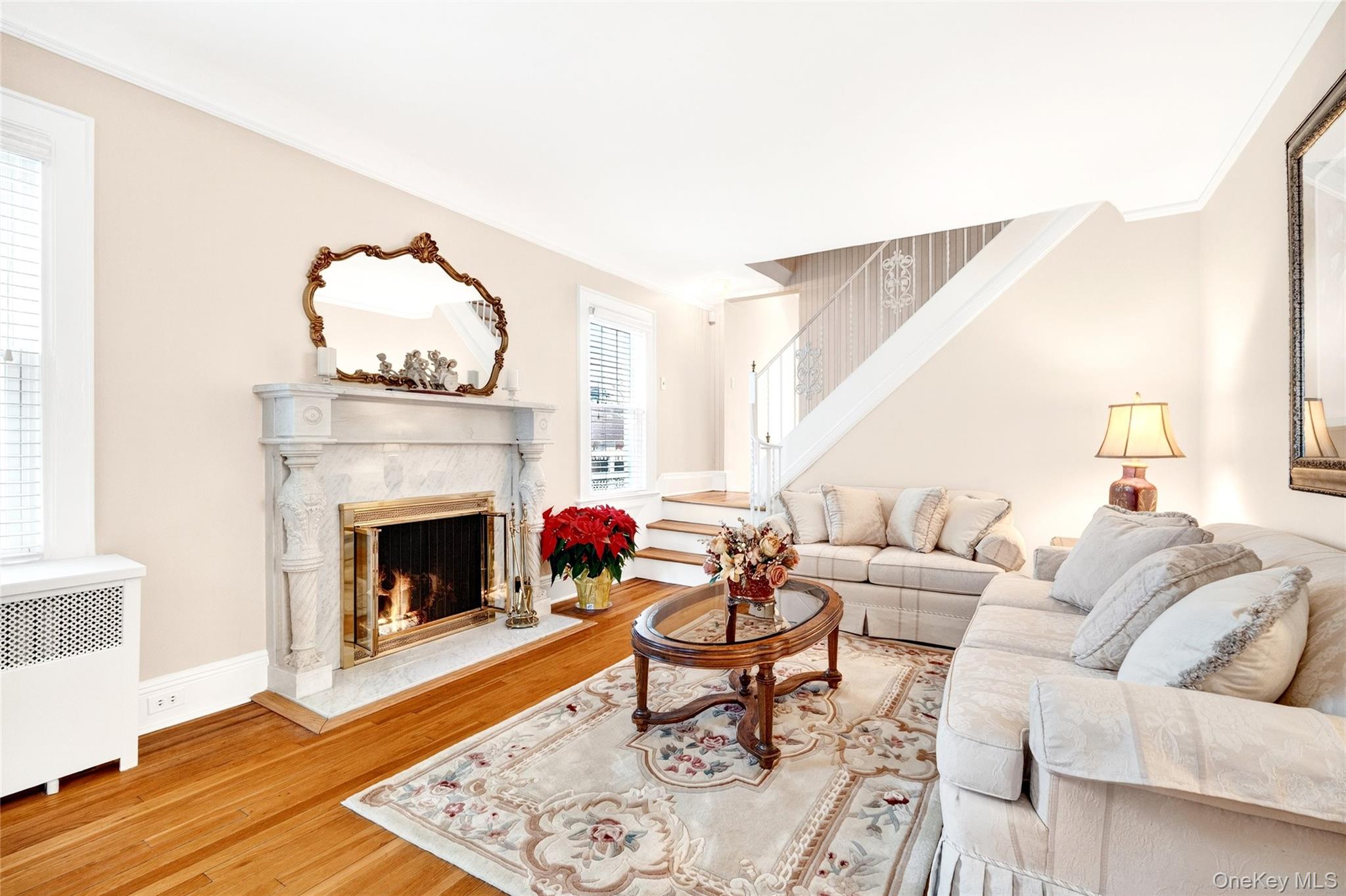 3334 Country Club Road Bronx, NY 10465 - Photo 7 of 49 Living room featuring a fireplace, wood finished floors, and radiator heating unit