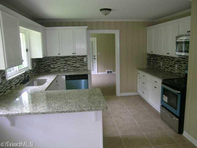 1214 Frye Bridge Road Clemmons, NC 27012 - Photo 1 of 13 Kitchen. New Granite Counter tops and SS appliances!
