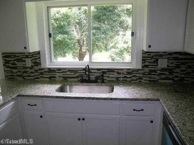 1214 Frye Bridge Road Clemmons, NC 27012 - Photo 4 of 13 Exterior Front. Kitchen with beautiful backsplash and granite.