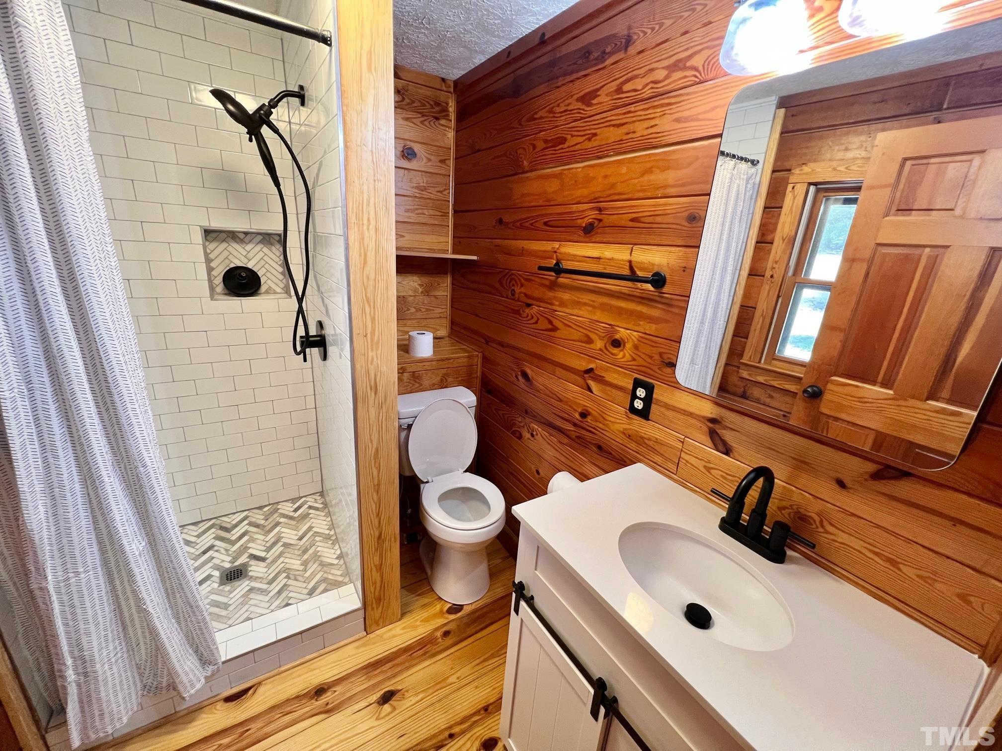 110 Keyser Lane Roxboro, NC 27574 - Photo 20 of 62 a bathroom with a sink and a mirror