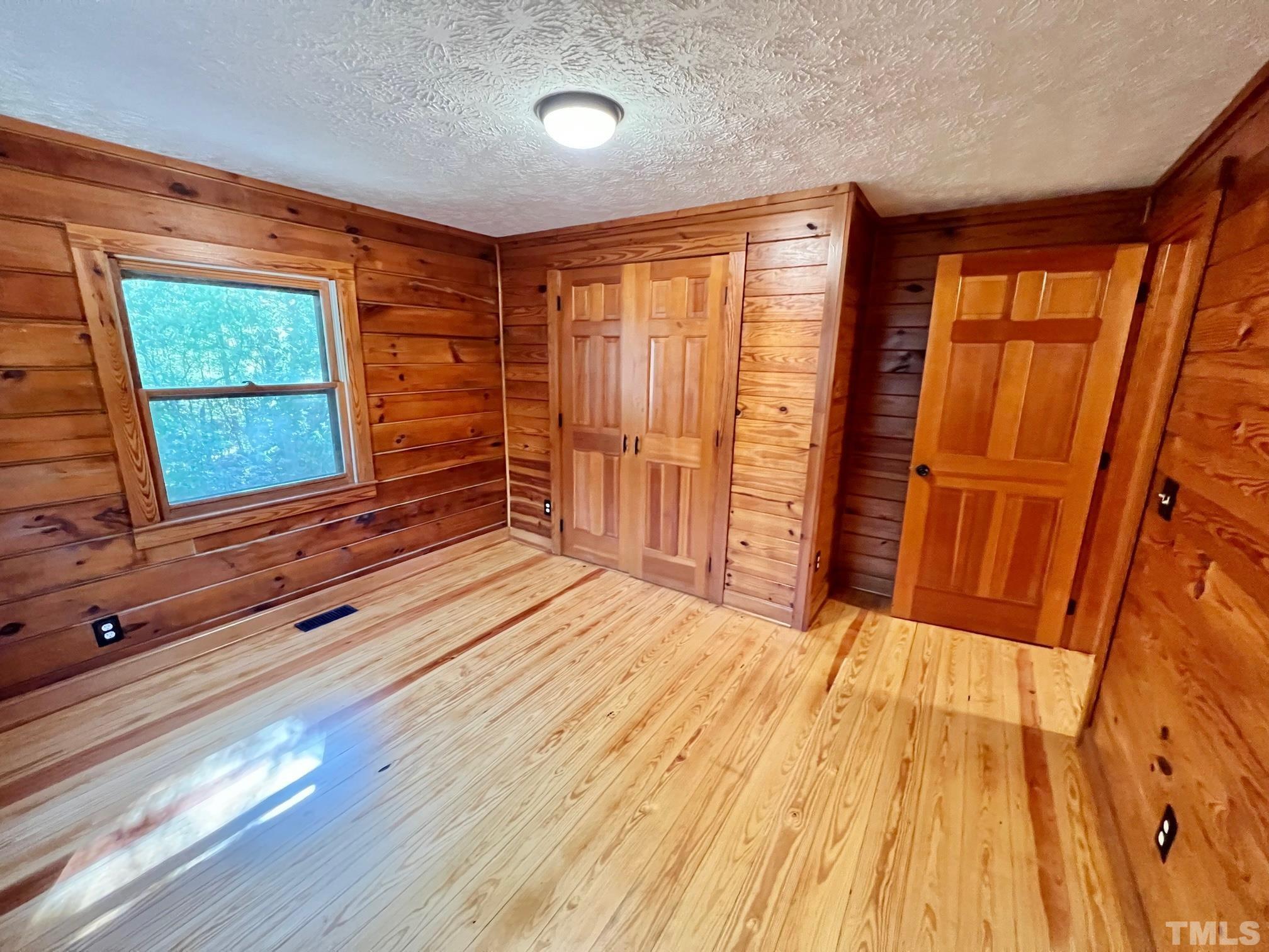 110 Keyser Lane Roxboro, NC 27574 - Photo 27 of 62 a view of a room with wooden floor and furniture