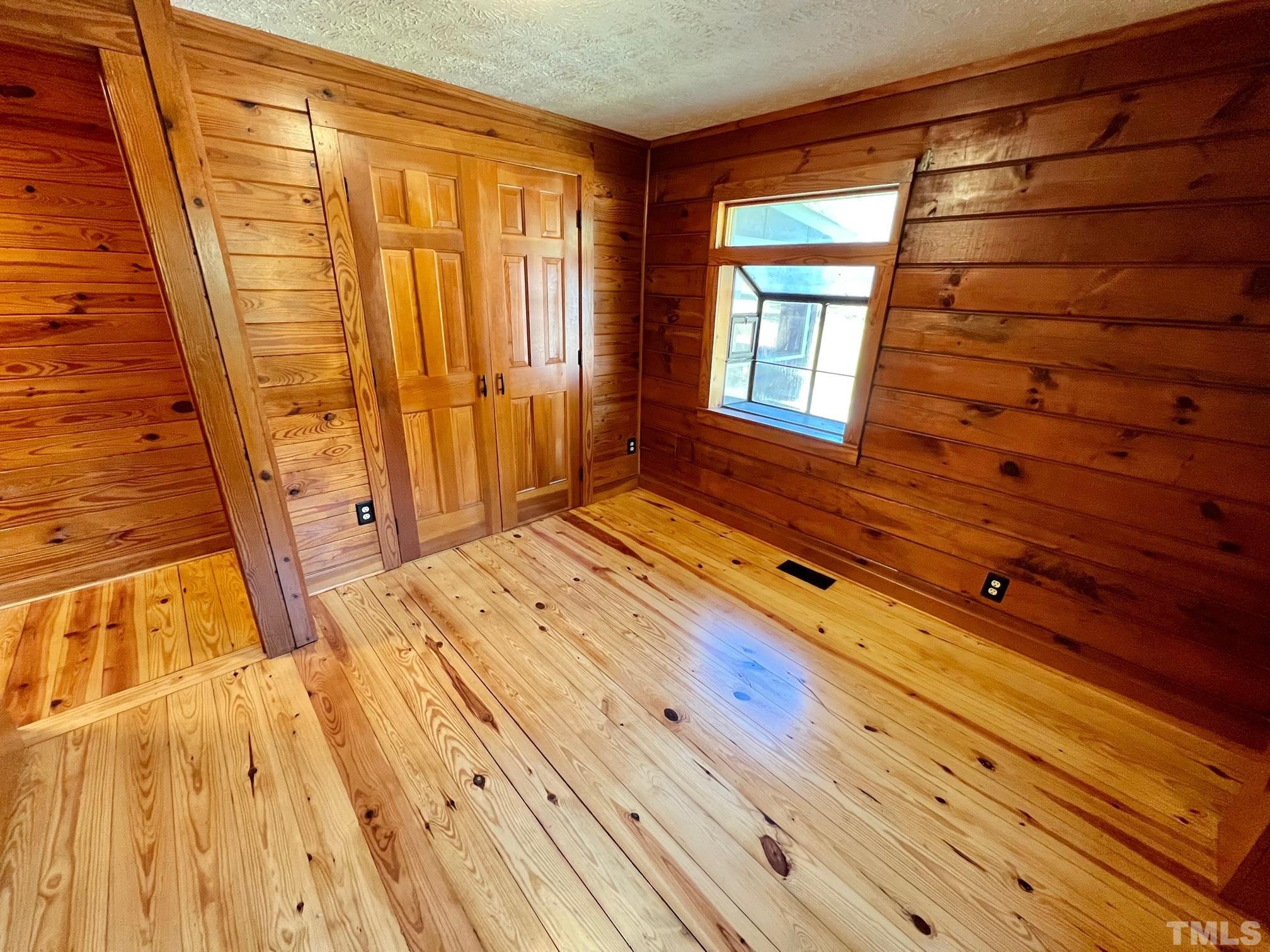 110 Keyser Lane Roxboro, NC 27574 - Photo 35 of 62 a view of front door with wooden floor and chair