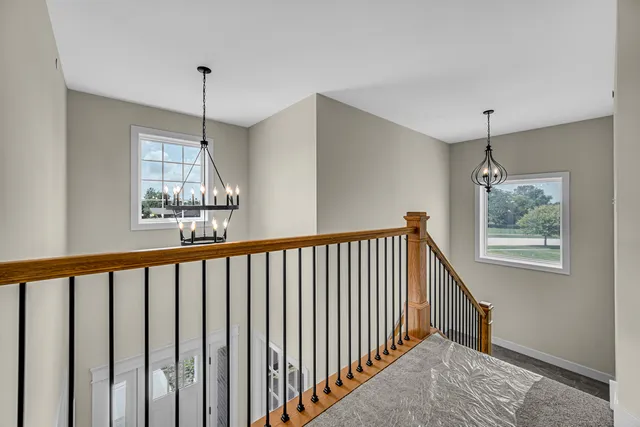 a view of a hallway with windows
