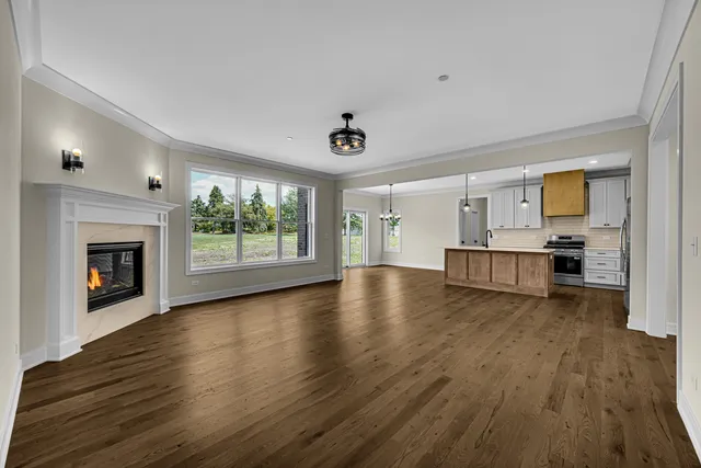 a view of kitchen with furniture and wooden floor