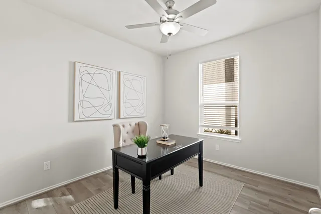 a view of a dining room with furniture and window