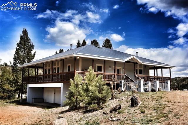 14 Apache Road Florissant, CO 80816 - Photo 1 of 15 Custom built, metal roof, 3 car garage and so much more!