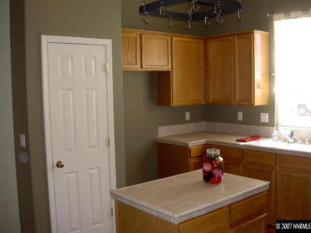 1621 Dutch Ravine Court Reno, NV 89521 - Photo 3 of 9 a kitchen with a sink cabinets and a window