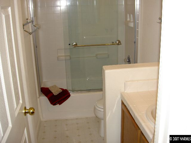 1621 Dutch Ravine Court Reno, NV 89521 - Photo 8 of 9 a bathroom with a sink and a shower