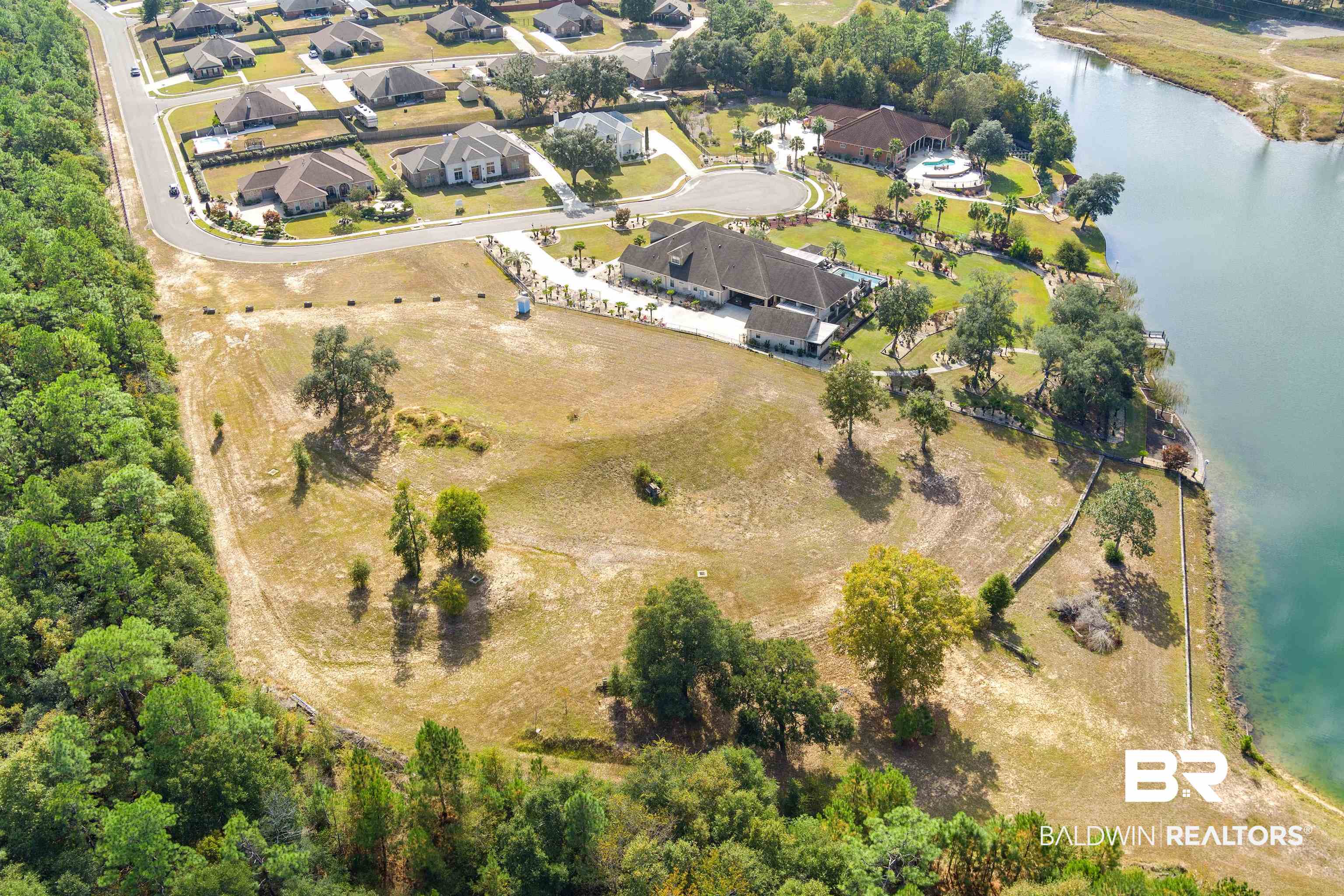 8512 Crepe Myrtle Court Mobile, AL 36619 - Photo 2 of 10 Aerial view of property and surrounding area with a large body of water and nearby suburban area