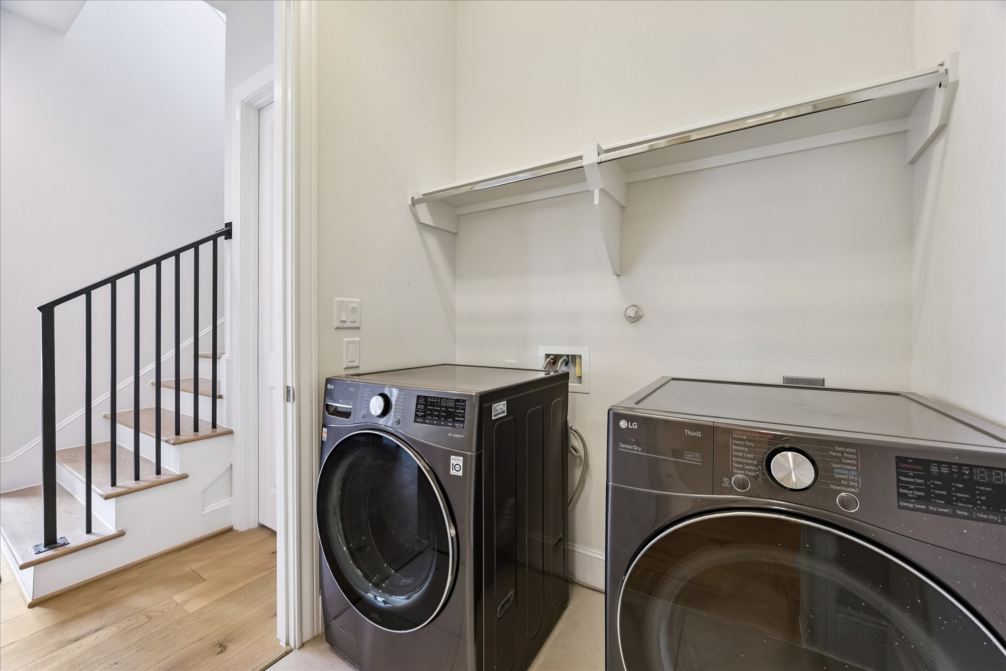 6108 Nicholas Grove Place Houston, TX 77055 - Photo 15 of 29 One of the smartest features in the home? The closet connects directly to the laundry room through this opening. It's a thoughtful design detail you'll appreciate every single day.