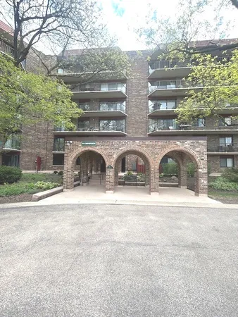 a front view of a house with parking yard