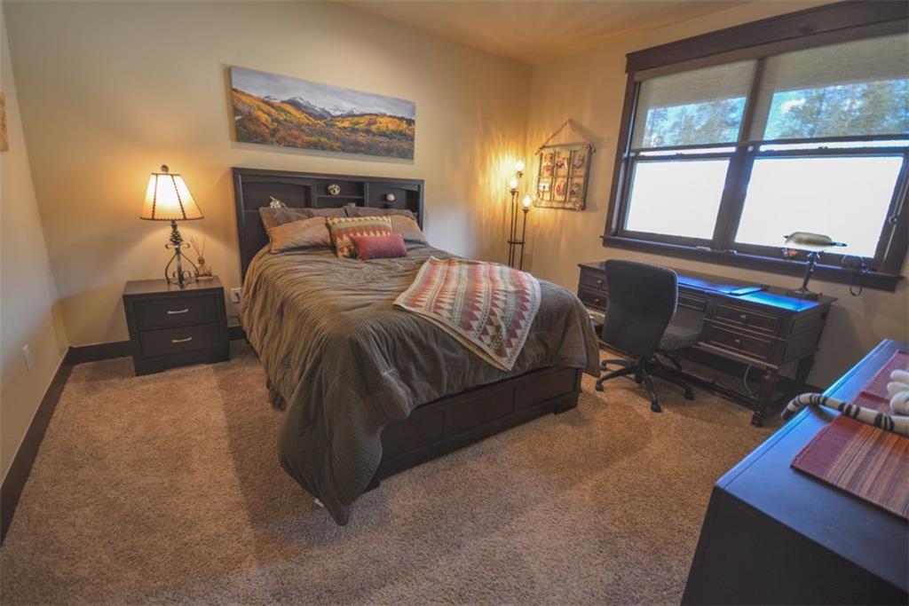 833 Independence Road, Unit 6A Keystone, CO 80435 - Photo 21 of 35 a bed room with a bed and a chair