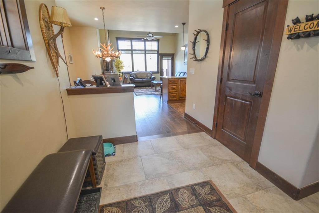 833 Independence Road, Unit 6A Keystone, CO 80435 - Photo 22 of 35 a view of dining room with furniture large window and wooden floor