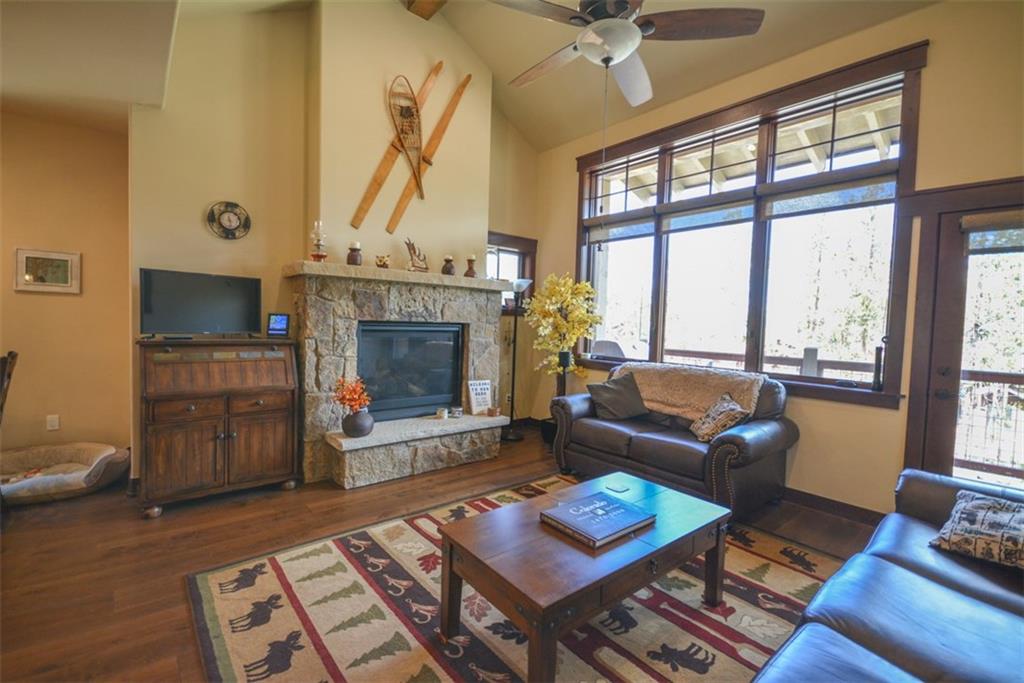 833 Independence Road, Unit 6A Keystone, CO 80435 - Photo 26 of 35 a living room with furniture a fireplace and a table