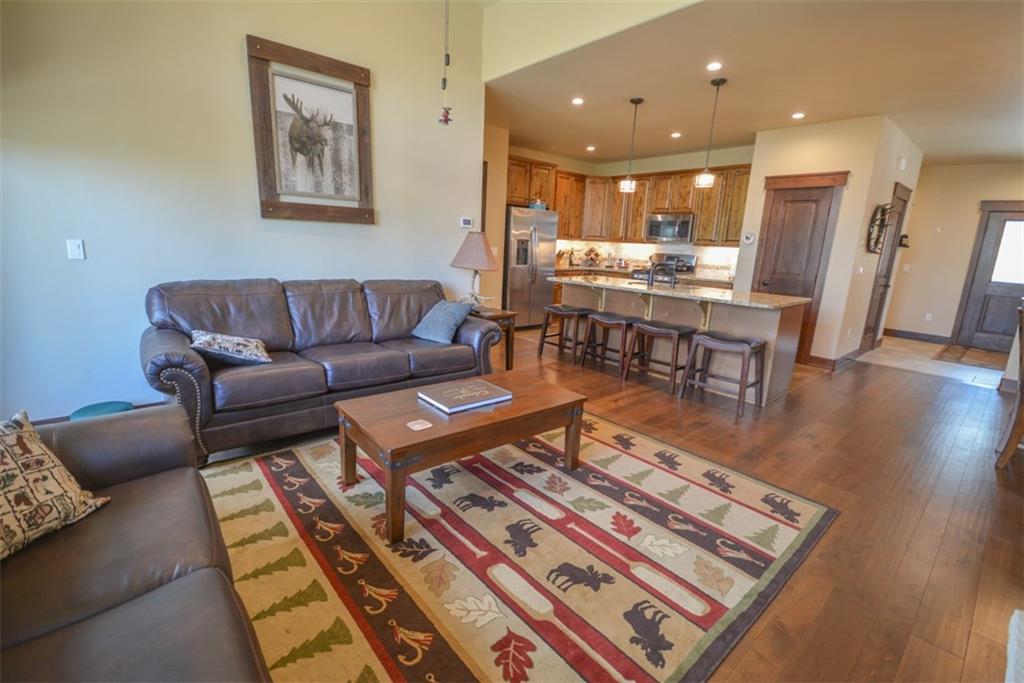 833 Independence Road, Unit 6A Keystone, CO 80435 - Photo 27 of 35 a living room with furniture and a wooden floor