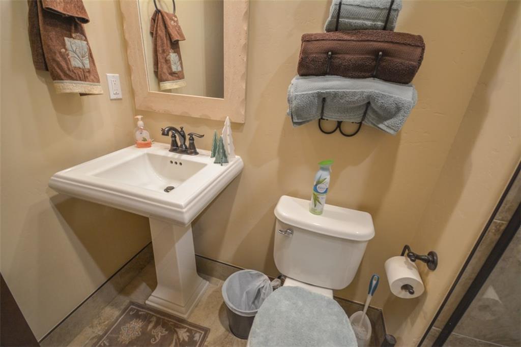 833 Independence Road, Unit 6A Keystone, CO 80435 - Photo 29 of 35 a bathroom with a sink mirror and toilet