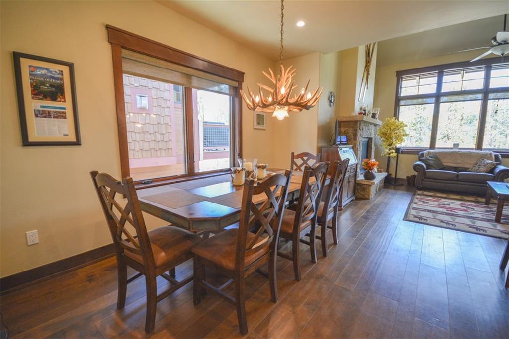 833 Independence Road, Unit 6A Keystone, CO 80435 - Photo 4 of 35 a view of a dining room with furniture window and wooden floor