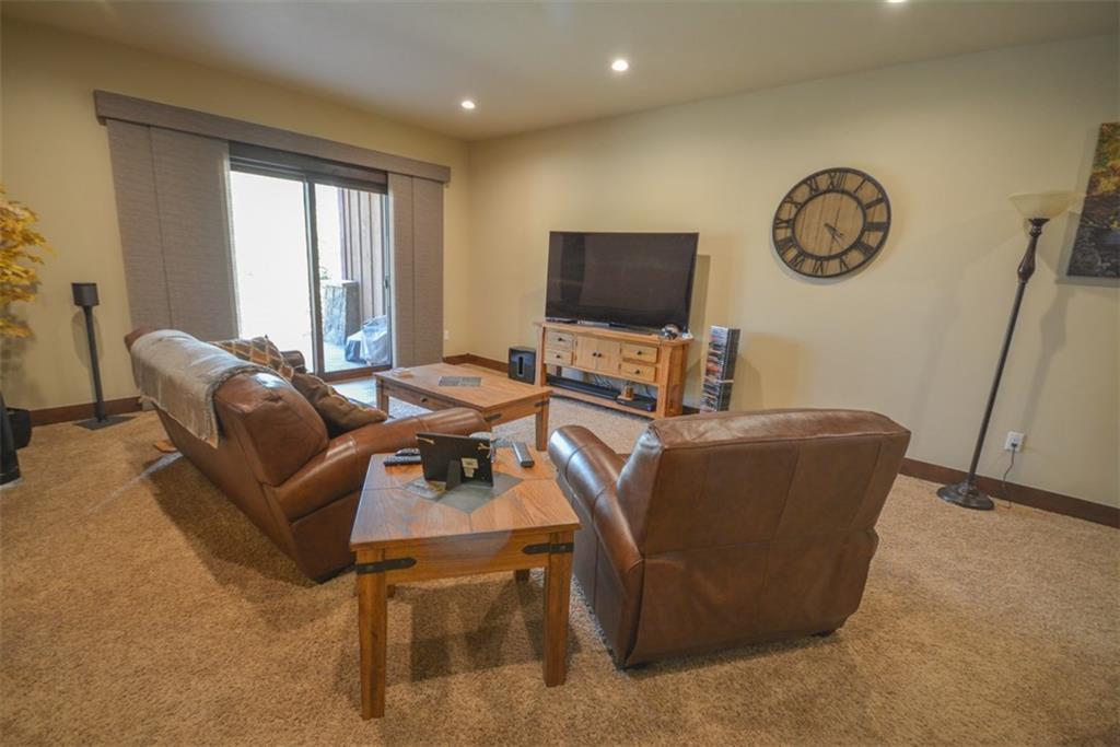 833 Independence Road, Unit 6A Keystone, CO 80435 - Photo 31 of 35 a living room with furniture a large window and a flat screen tv