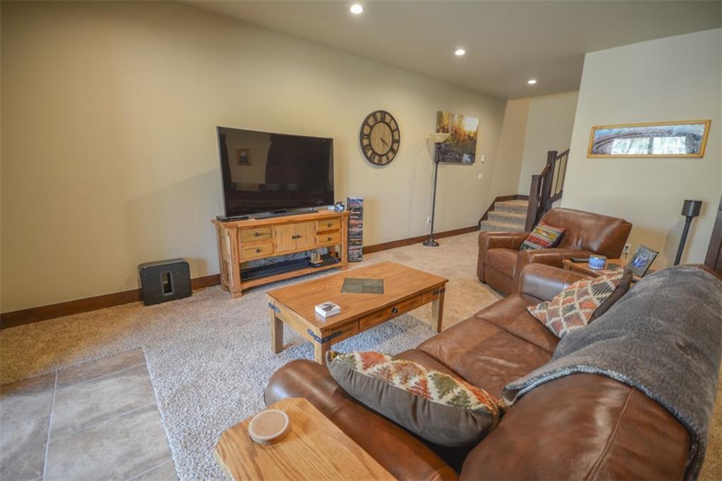 833 Independence Road, Unit 6A Keystone, CO 80435 - Photo 32 of 35 a living room with furniture and a flat screen tv