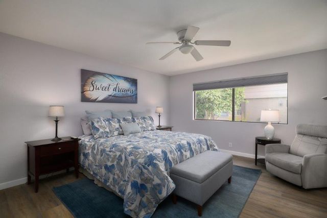 a bedroom with a bed and a couch