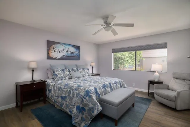 a bedroom with a bed and a couch