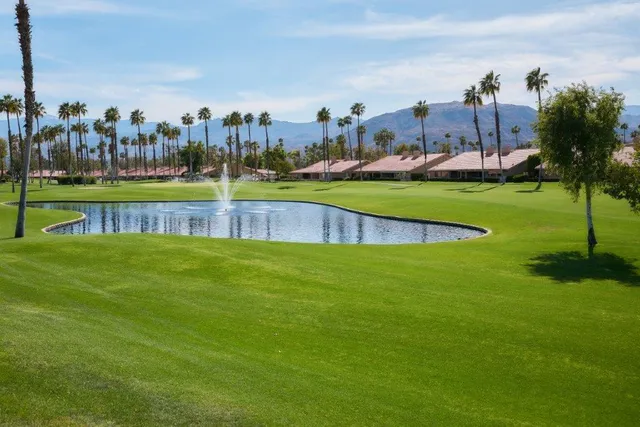 a view of a golf course with a lake