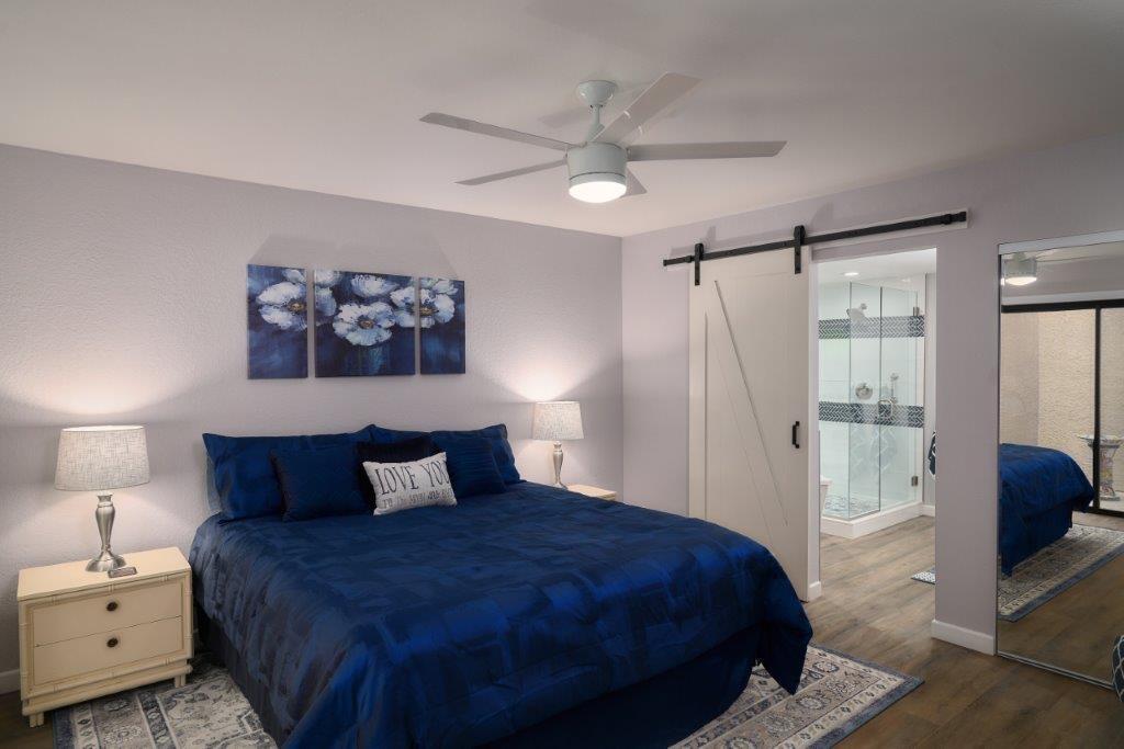 25 Maximo Way Palm Desert, CA 92260 - Photo 6 of 15 a bedroom with a bed and a walk in closet