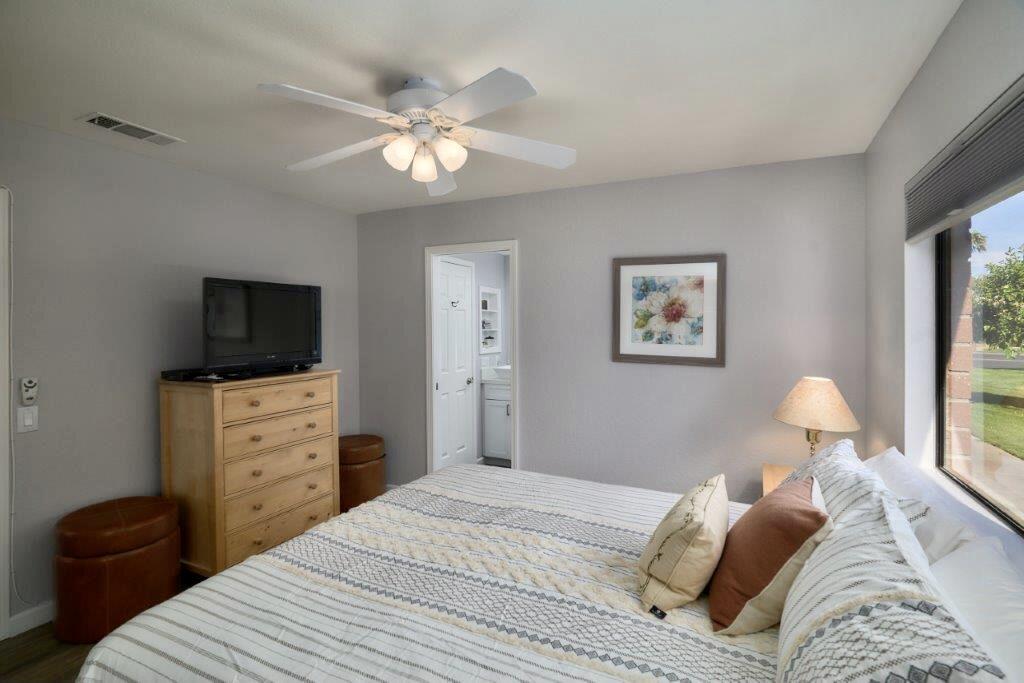 25 Maximo Way Palm Desert, CA 92260 - Photo 7 of 15 a bedroom with a bed and a television
