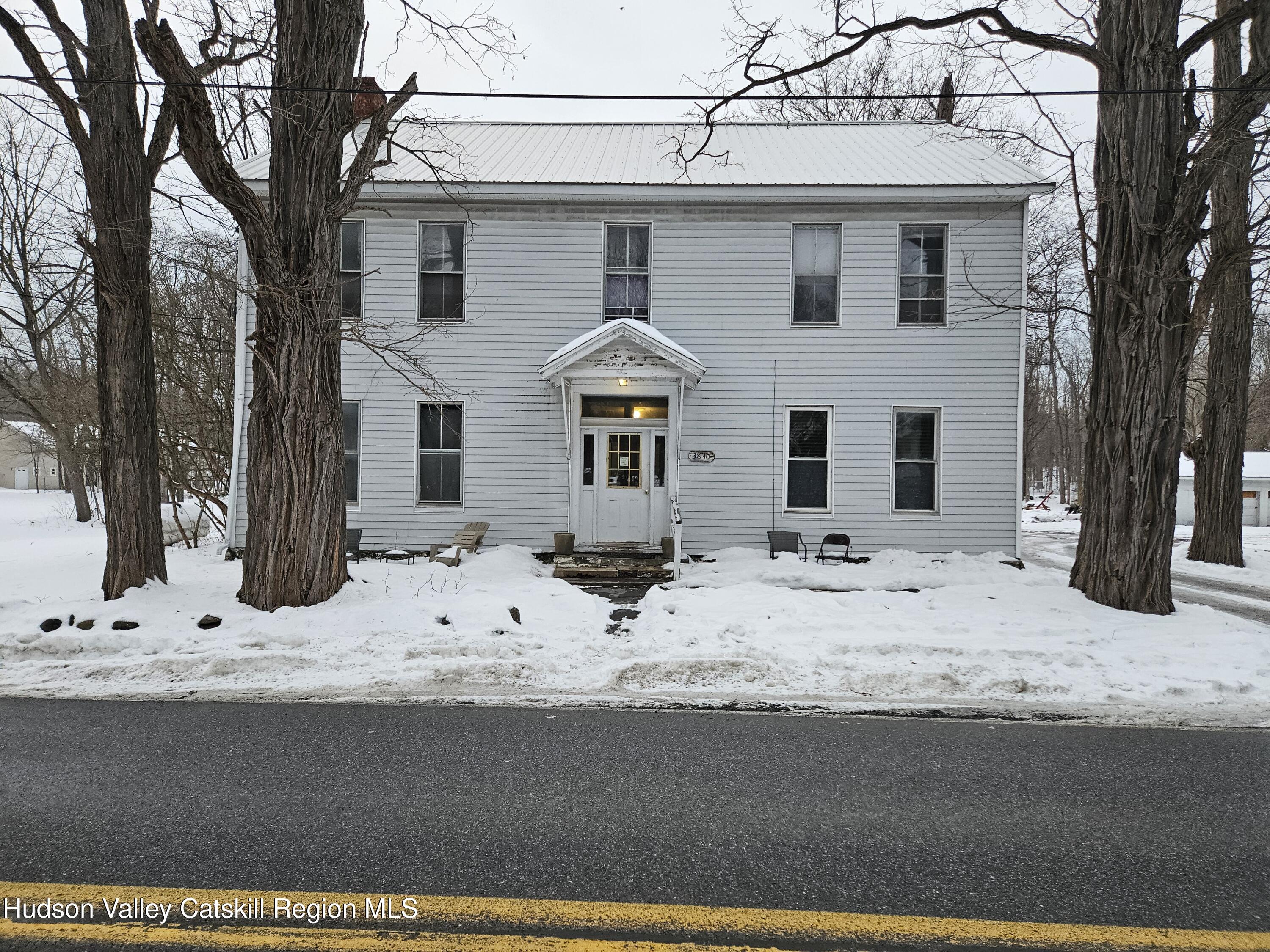 3630 County Rt 67 Freehold, NY 12431 - Photo 1 of 7 a front view of a house with snow on side of road