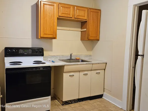 a kitchen with stainless steel appliances granite countertop a cabinets and a stove