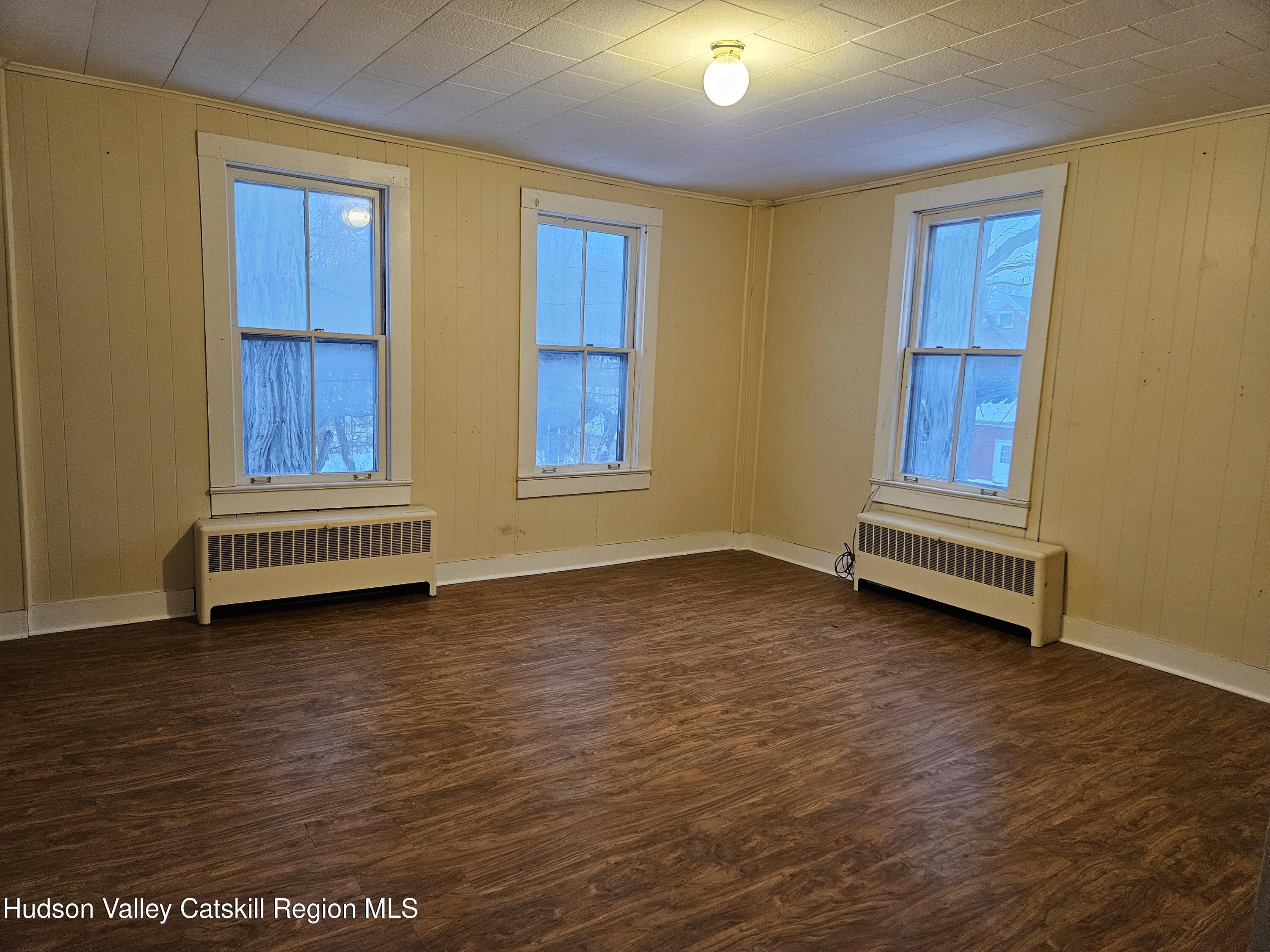 3630 County Rt 67 Freehold, NY 12431 - Photo 5 of 7 a view of room with wooden floor and cabinet