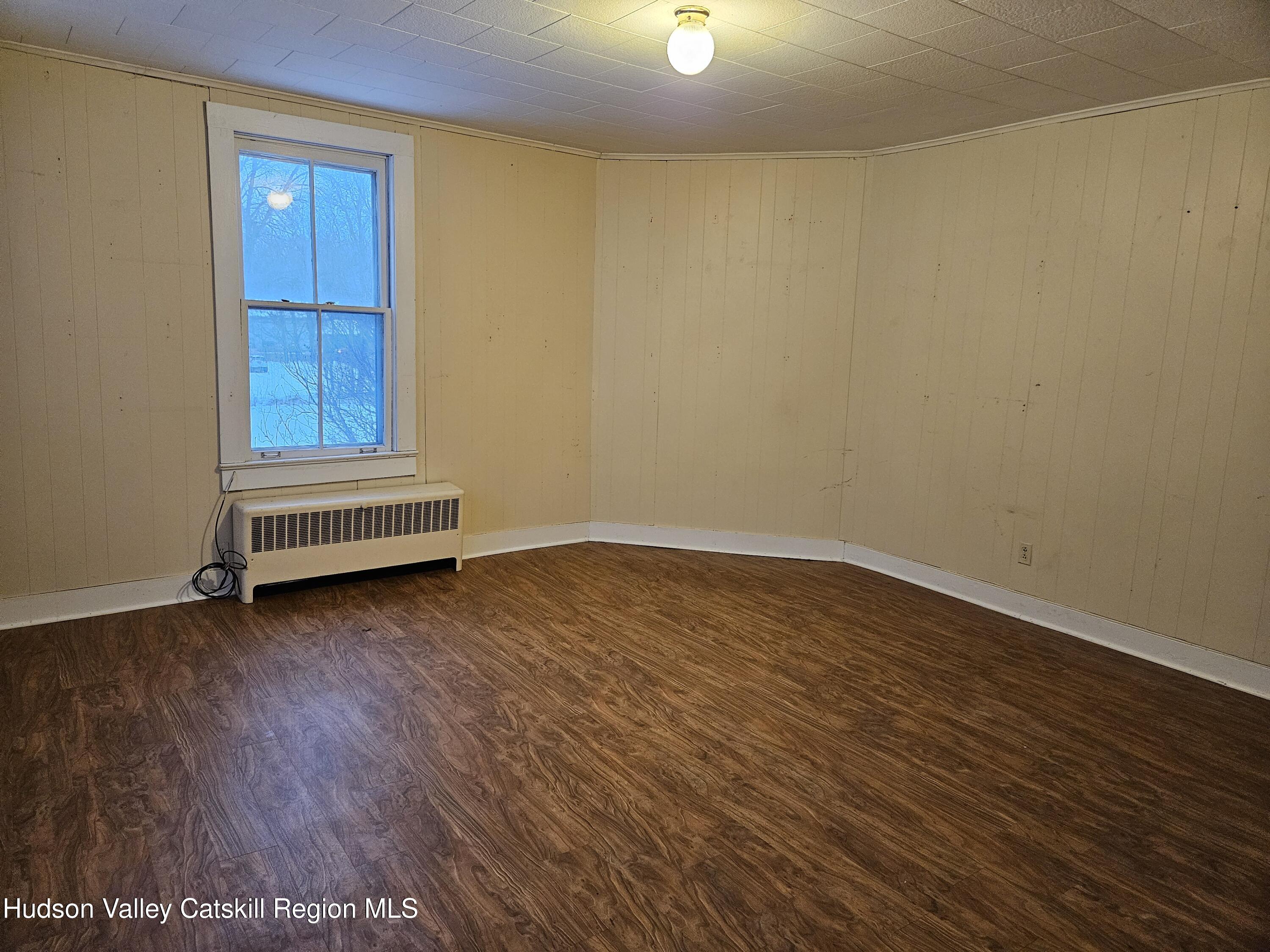 3630 County Rt 67 Freehold, NY 12431 - Photo 6 of 7 wooden floor in an empty room with a window