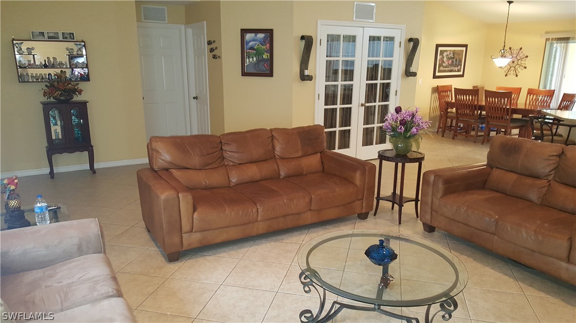 9041 Buckingham Road Fort Myers, FL 33905 - Photo 3 of 11 a living room with furniture and a table