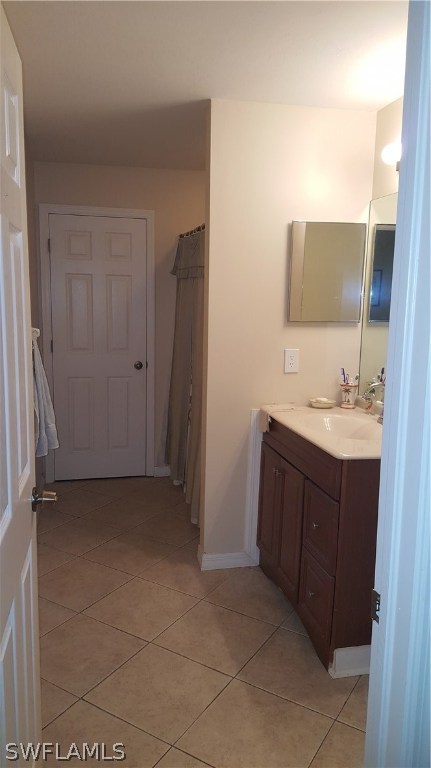 9041 Buckingham Road Fort Myers, FL 33905 - Photo 10 of 11 a room with a bench and wooden floor