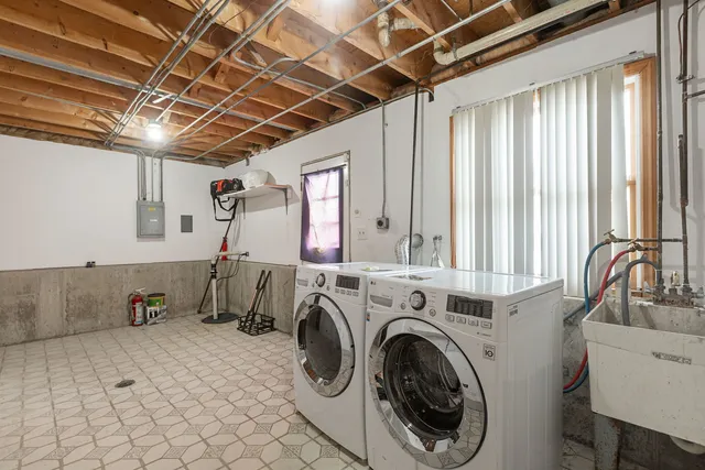 a view of a storage & utility room with washer and dryer