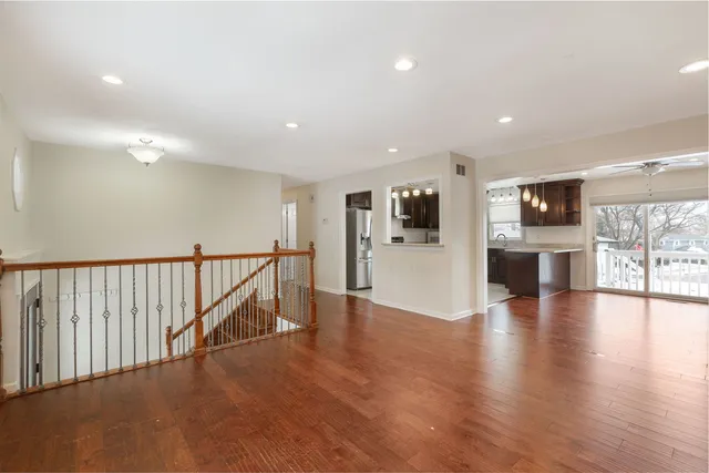 a view of a kitchen with a sink and a refrigerator