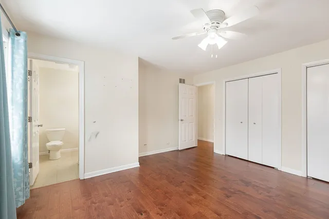 a view of an empty room with a bathroom