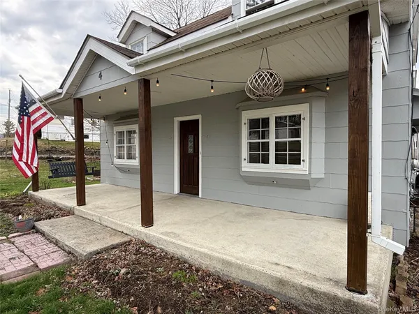 a front view of a house with a porch