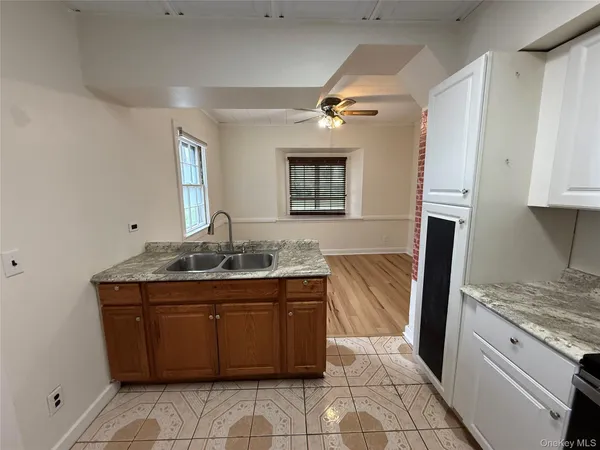 a kitchen with a sink and a refrigerator