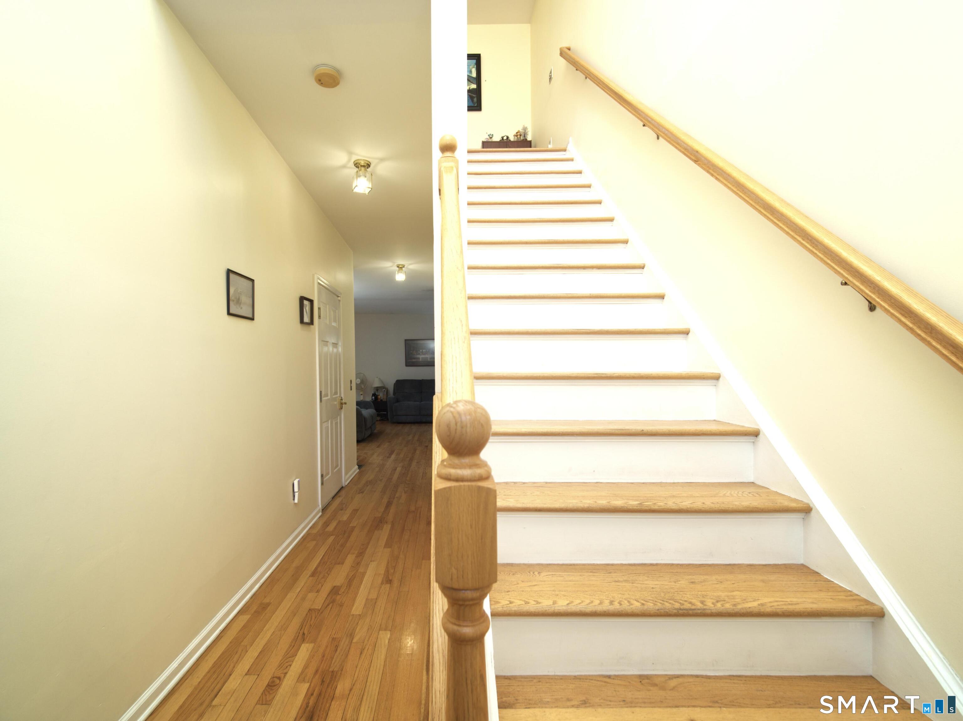 65 Benton Street, Unit 65 Fairfield, CT 06825 - Photo 12 of 35 a view of entryway and hall with wooden floor