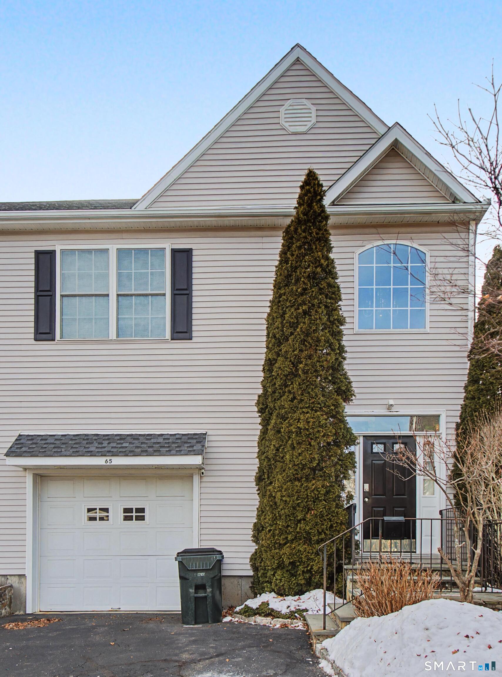 65 Benton Street, Unit 65 Fairfield, CT 06825 - Photo 23 of 35 a front view of a house