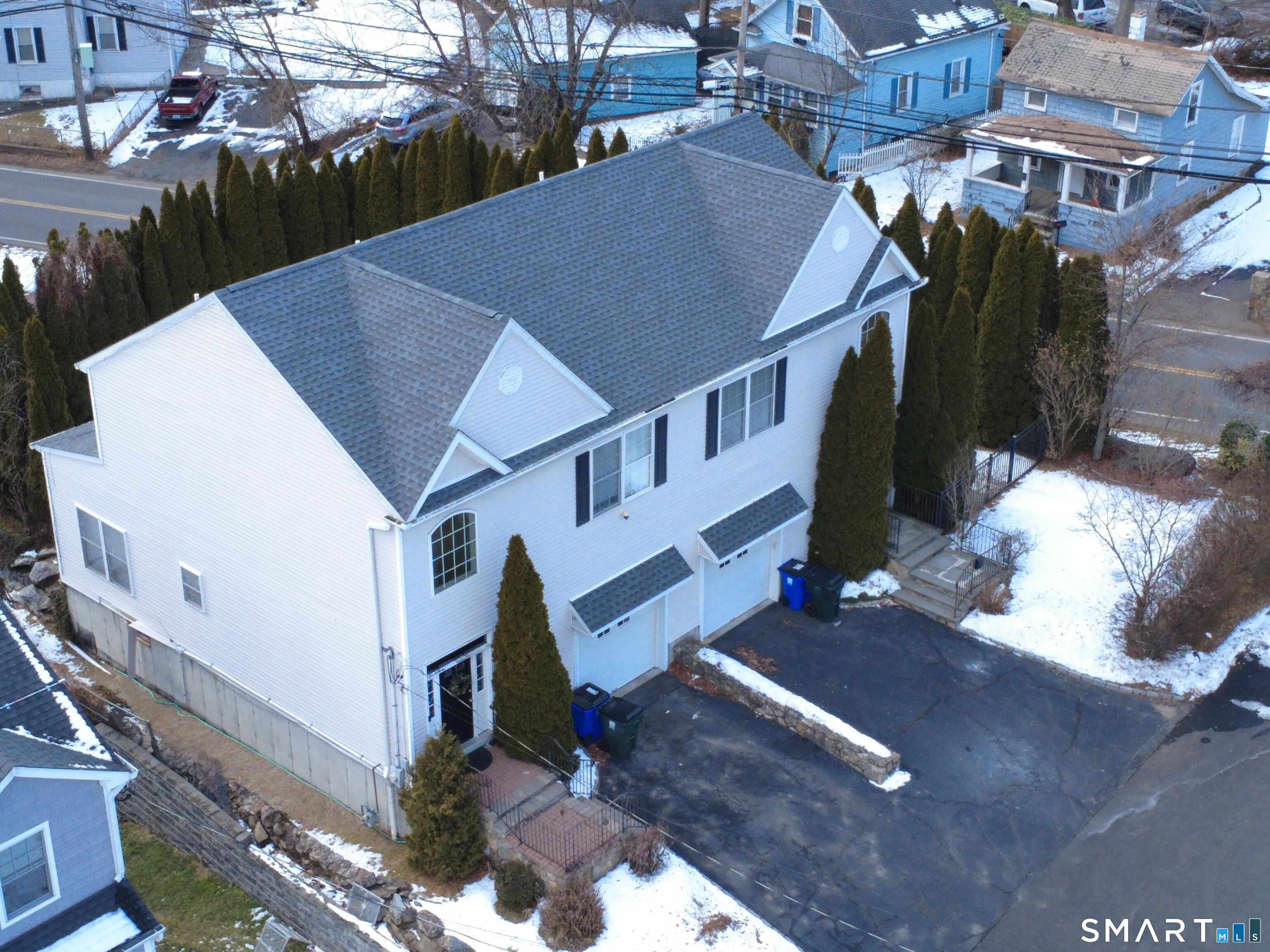 65 Benton Street, Unit 65 Fairfield, CT 06825 - Photo 3 of 35 a view of a house with a yard