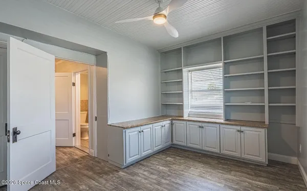a kitchen with a cabinets and window