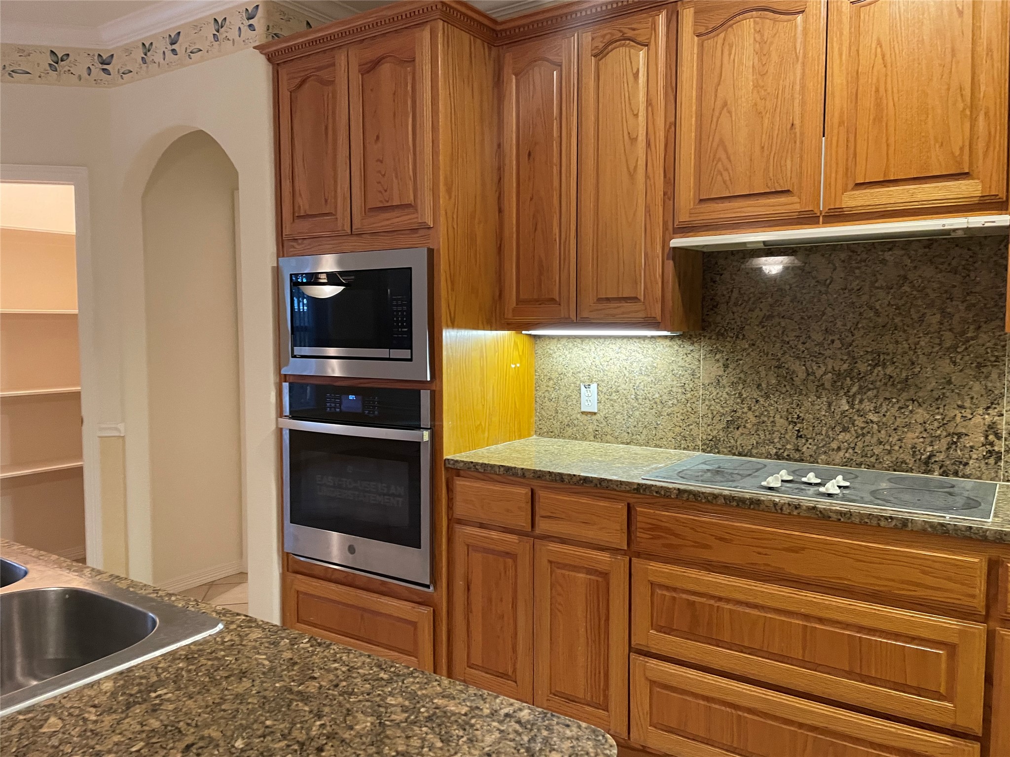 120 Brazos Drive Georgetown, TX 78628 - Photo 11 of 33 a kitchen with granite countertop a refrigerator and cabinets